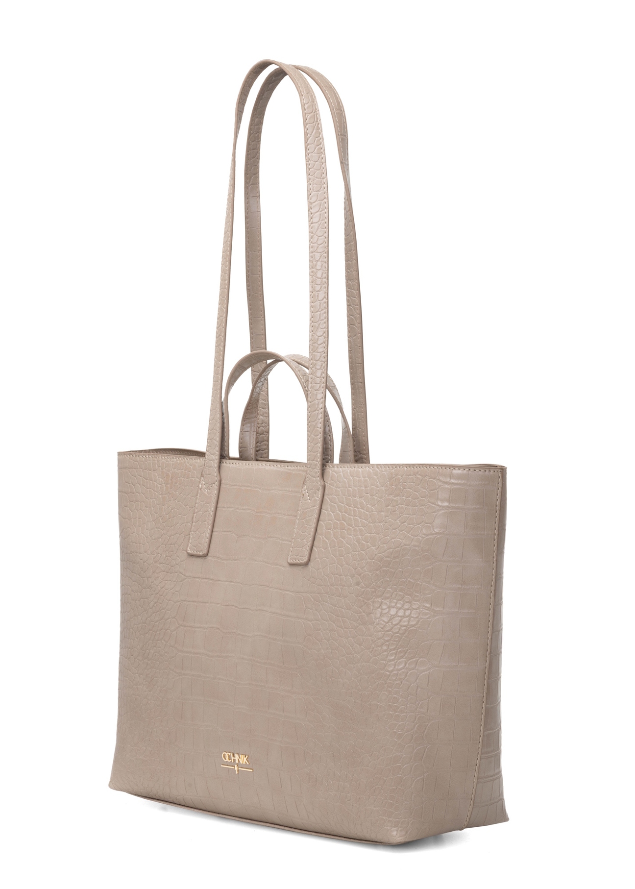 Beżowa torebka damska shopper TOREC-1204-1D(W26), widok produktu skosem na białym tle.